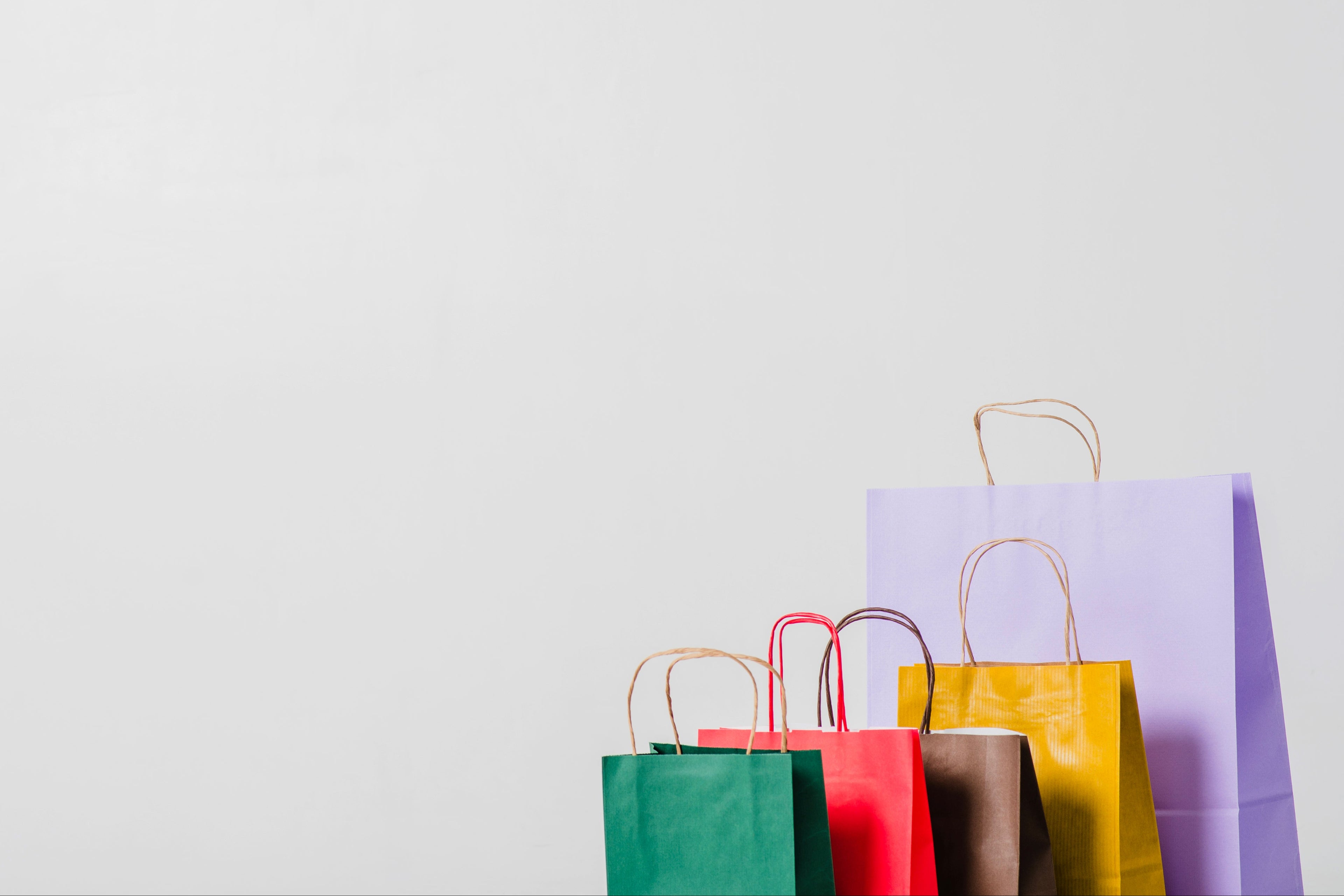 Colorful shopping bags on a light gray background